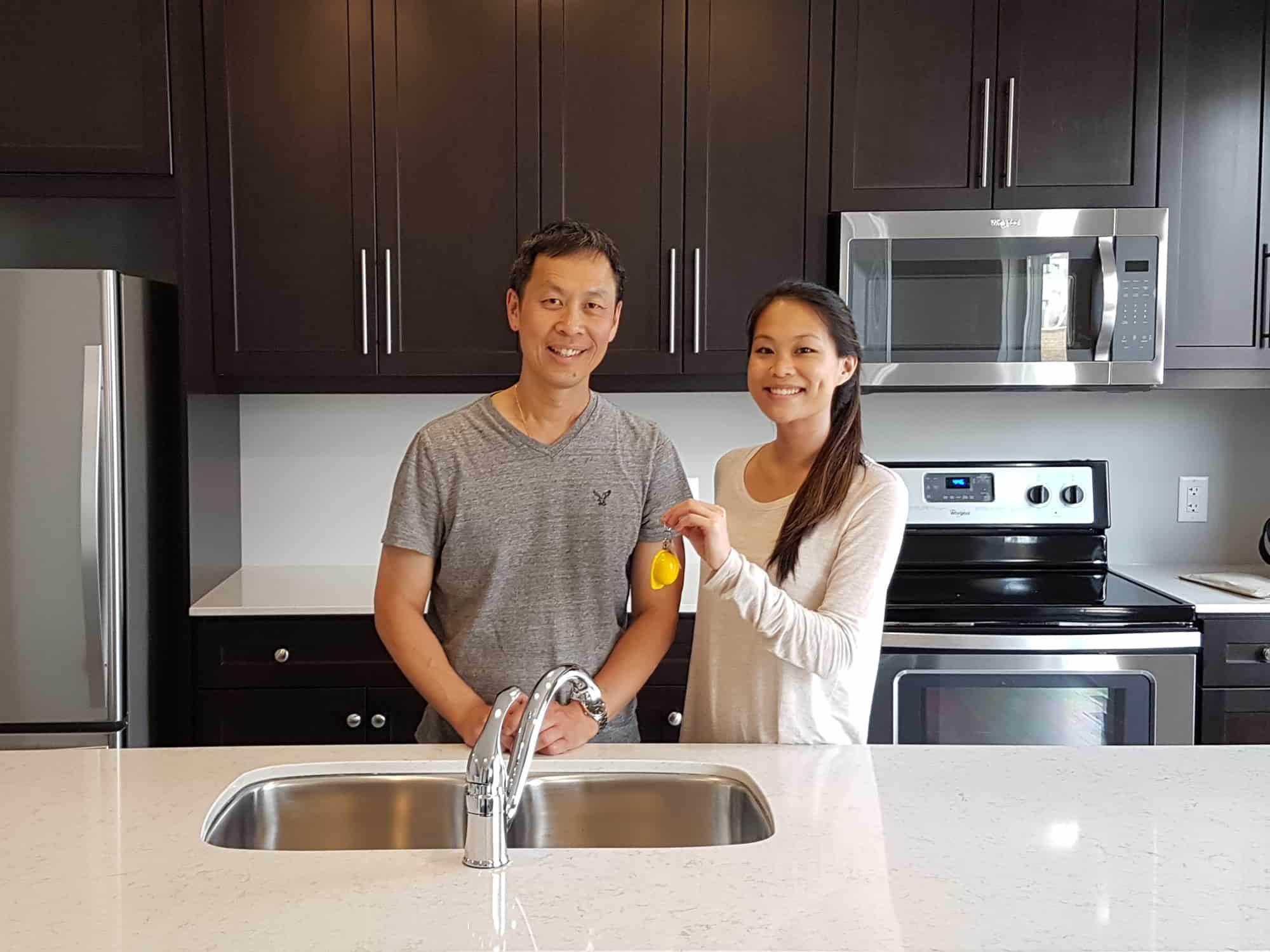 Ironstone Home Owners in their new kitchen